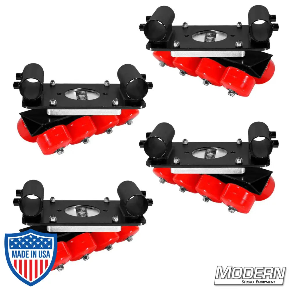 Set of four black zinc skateboard wheel speed-rail brackets with red wheels for film grip rigging setups.