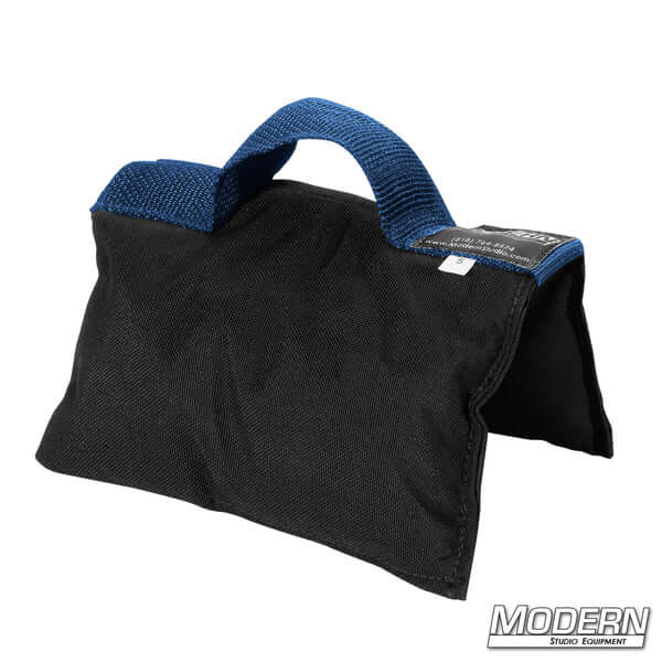 Black sandbag with blue handle, filled with five pounds of silica sand, made of Cordura 1000, ideal for film, grip, and rigging purposes.