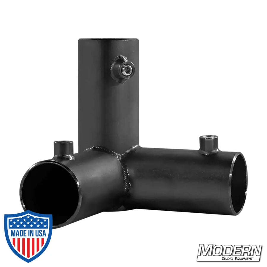 Black zinc 3-way pass through corner fitting for 1-1/2 inch Speed-Rail®, used for film grip rigging.