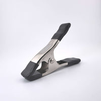 Silver #1 grip clip spring clamp with black rubber tips and an ergonomic handle, ideal for film grip and rigging tasks.