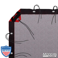 Black Double Scrim with grommets, webbing, and elastic corners for film grip rigging, includes storage bag, reduces light without altering color.