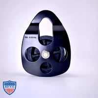 Black Film Pulley CMI RP101FS with anodized aluminum sideplates for film rigging and grip, 6000 lbs. MBS capacity, stainless steel axle