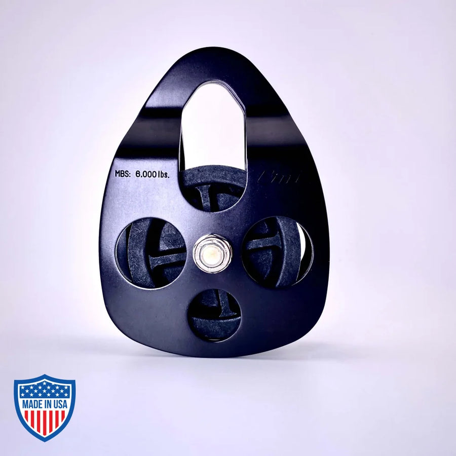 Black Film Pulley CMI RP101FS with anodized aluminum sideplates for film rigging and grip, 6000 lbs. MBS capacity, stainless steel axle