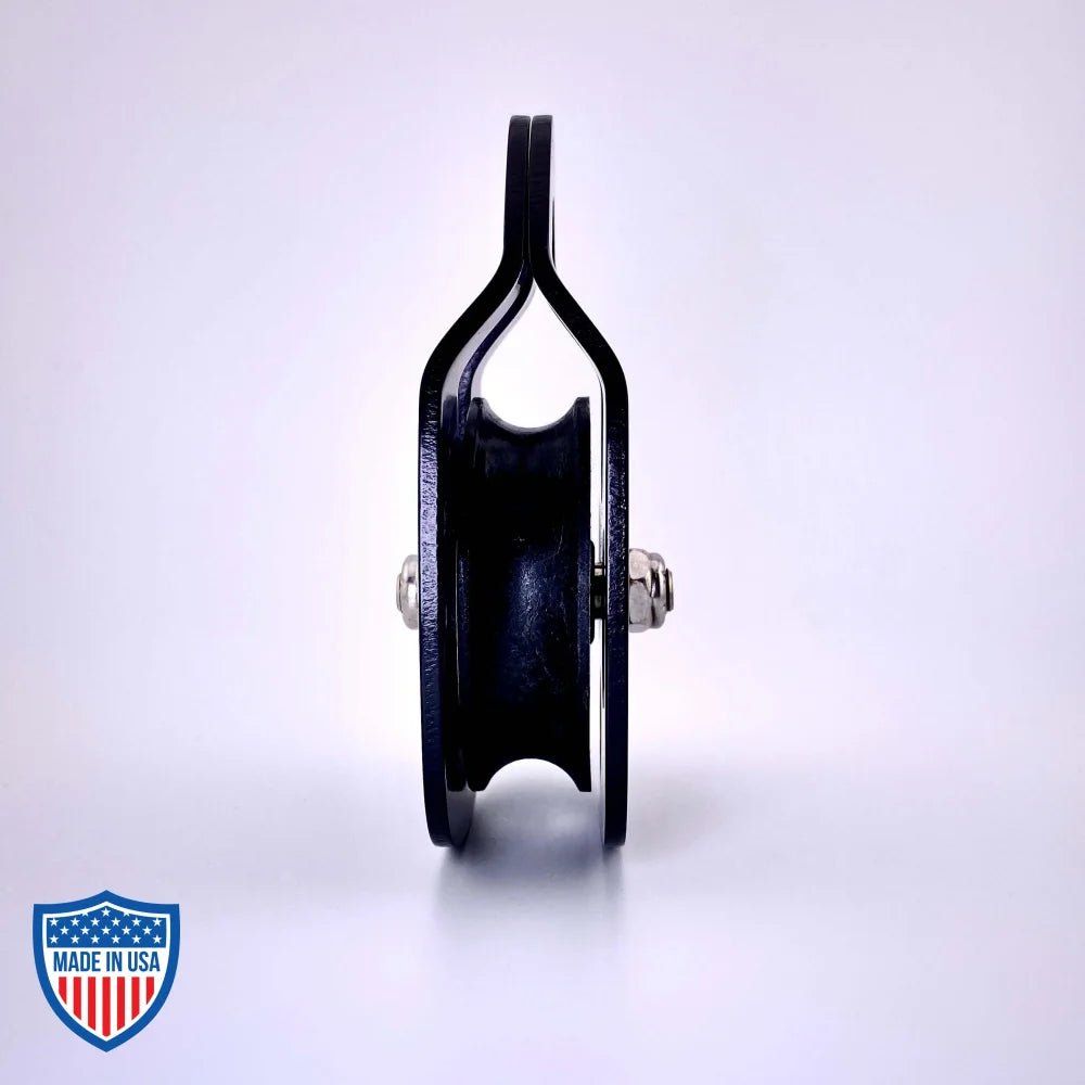 Black Film Pulley CMI RP101FS with anodized aluminum sideplates, ideal for film grip and rigging, shown against a white background.