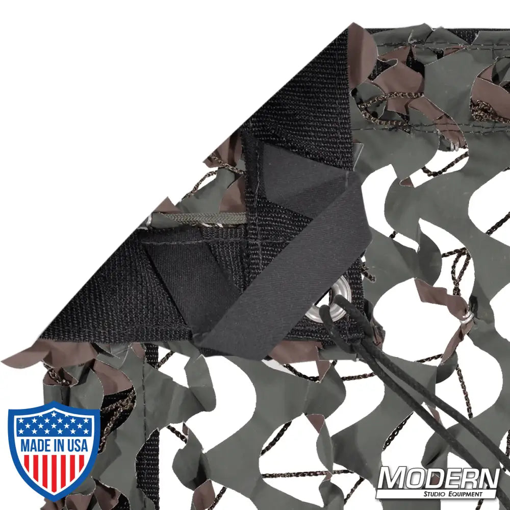 Camo net textile with webbing, grommets, ties, and elastic corners for film grip rigging, includes storage bag, Modern Studio Equipment logo