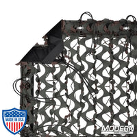 Camo net with webbing, grommets, ties, and elastic corners for quick rigging and storage bag, perfect for film grip essentials