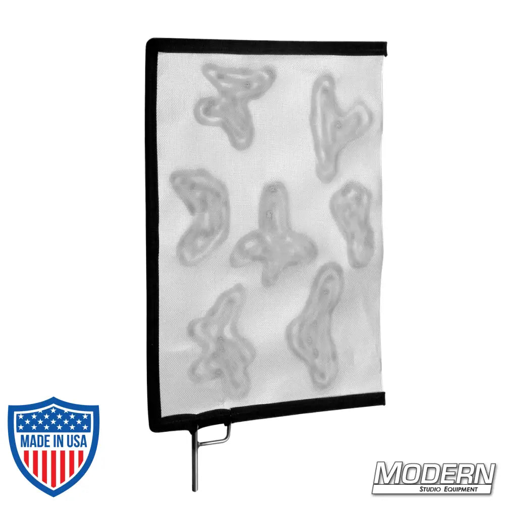 Screen glass with cucoloris pattern for film grip and rigging, casting shadow patterns on backgrounds or subjects.