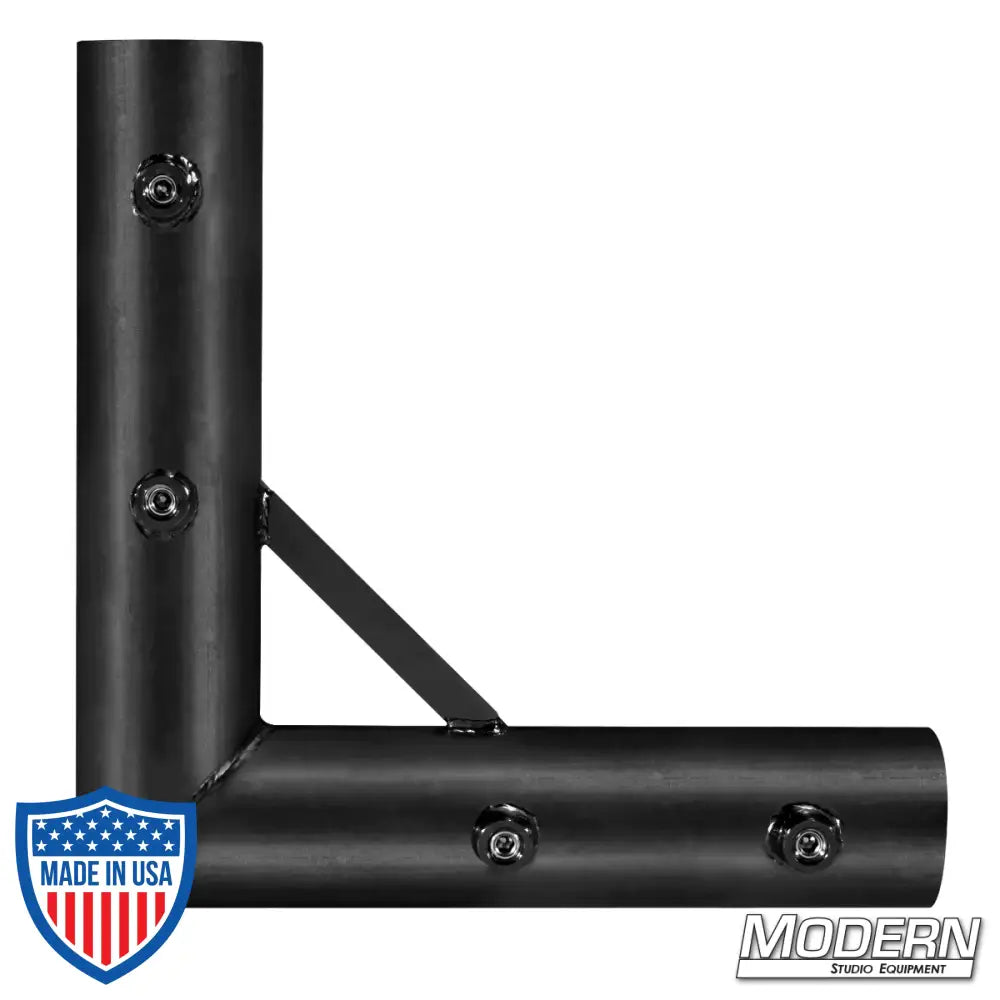 Black zinc 90º corner fitting with set screws for 1-1/2" Speed-Rail® used in film grip and rigging.