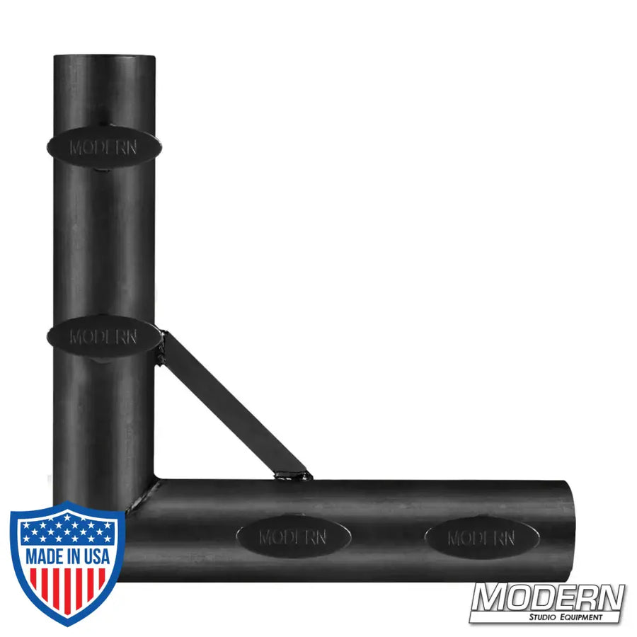Black zinc corner fitting for 1-1/4-inch Speed-Rail® with T-handles, creating a 90º corner for film grip and rigging applications.