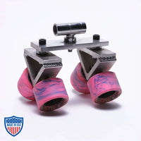 Doorway dolly skateboard wheels with pink grip, used for rigging in film production.