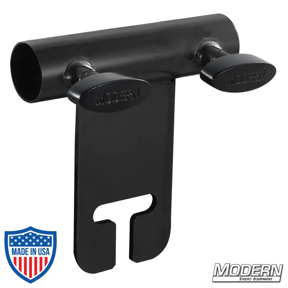 Black zinc ear adapter for 1-inch round pipe with T-handles, used for film grip rigging with gobo/grip head attachment.