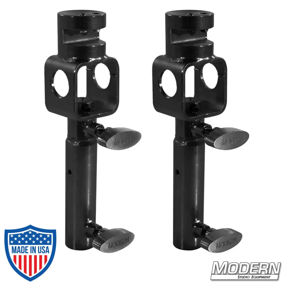 Set of two black zinc I-beam clamps with junior swivel receivers for film grip and rigging equipment.