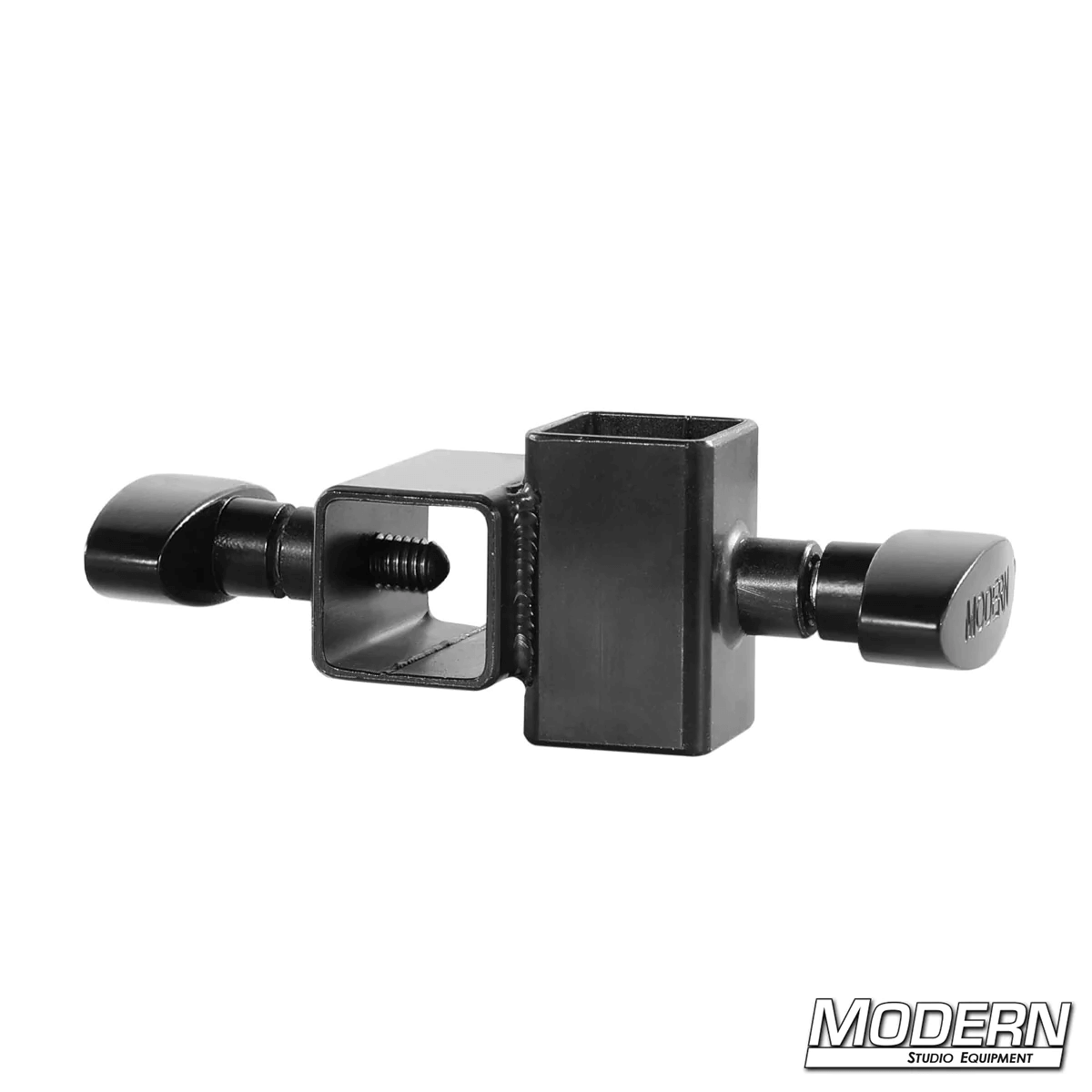 Mini Cross fitting for 1-inch square tube in black zinc with T-handles for film grip rigging, used to connect aluminum at 90-degree angle.