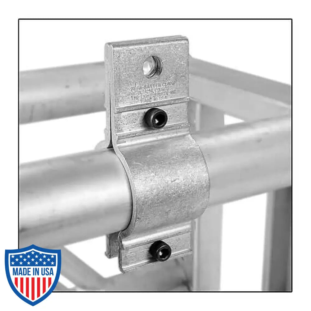 Mega-Batten Clamp securing 1-1/2" pipe for film grip rigging, showcasing tight compression fit and sturdy construction with socket cap screws.