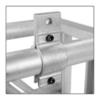 Mega-Batten Clamp securing 1-1/2" pipe for film grip rigging, showcasing tight compression fit and sturdy construction with socket cap screws.