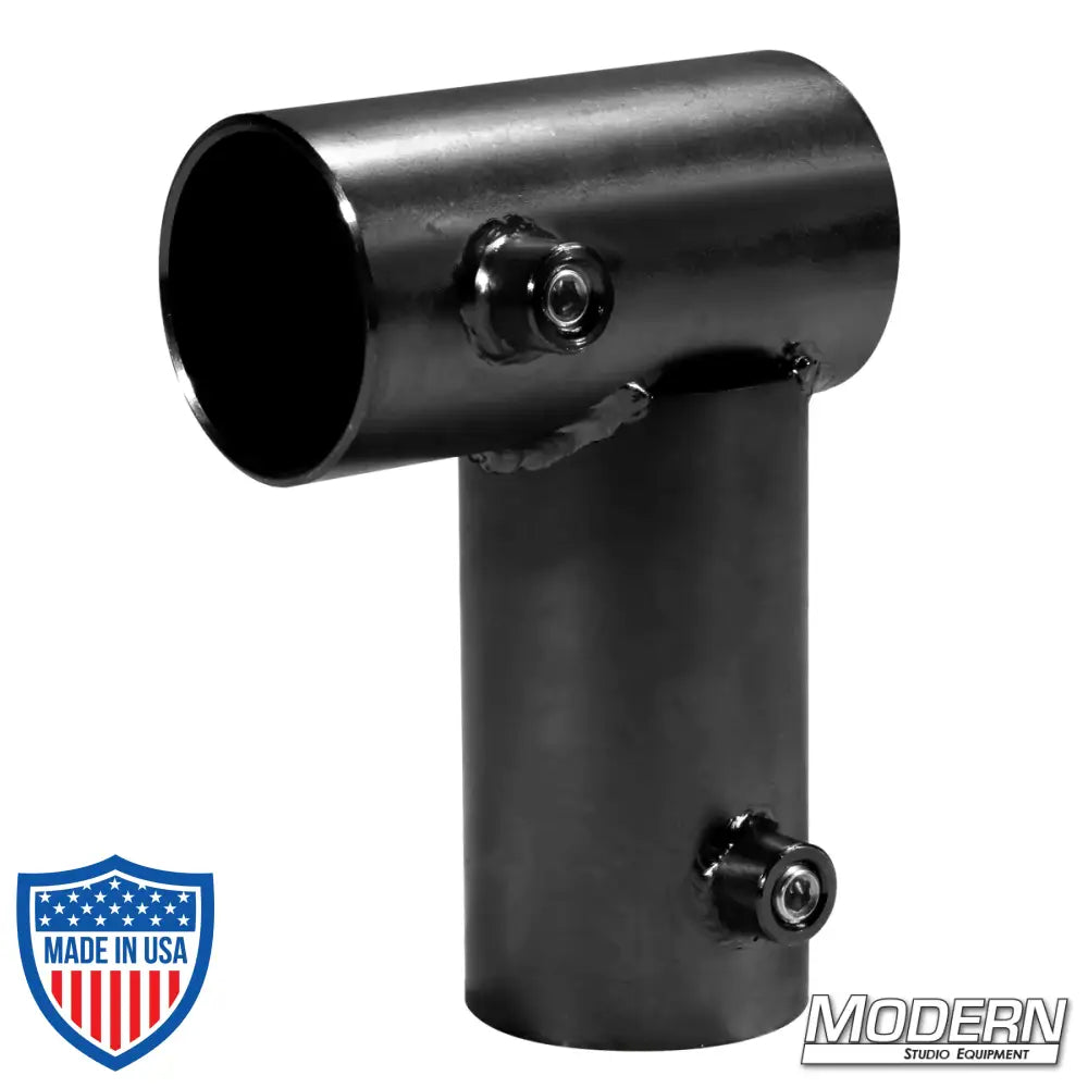 Black zinc mini corner fitting with set screws for 1-1/2-inch Speed-Rail®, used for 90° corners in film grip rigging and frames.