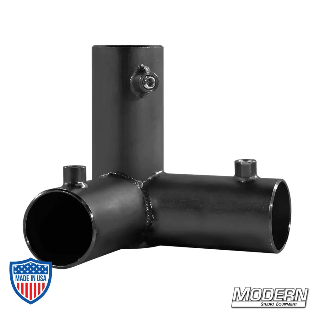 Black zinc 3-way pass through corner fitting for 1-1/2" Speed-Rail®, used for film grip rigging.
