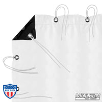 Black/white poly bounce fabric with webbing, grommets, and ties for film grip rigging, showing durable construction and outdoor suitability.