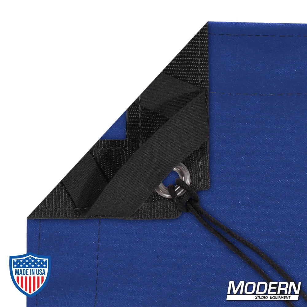Blue waterproof textile for film grip and rigging, featuring webbing, grommets, ties, elastic corners, and a storage bag.
