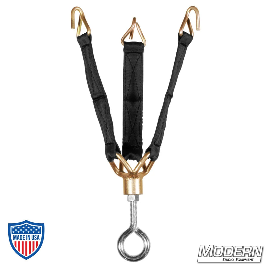 Black and gold camera tripod tie-down for film grip and rigging.