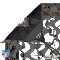 Camo net textile with webbing, grommets, ties, and elastic corners for film grip rigging, includes storage bag, Modern Studio Equipment logo