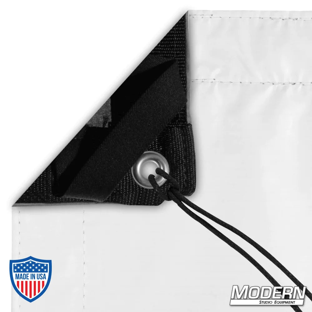 Claycote with grommets and ties, featuring webbing and elastic for film grip and rigging, shown in matte white and black reversible sides.