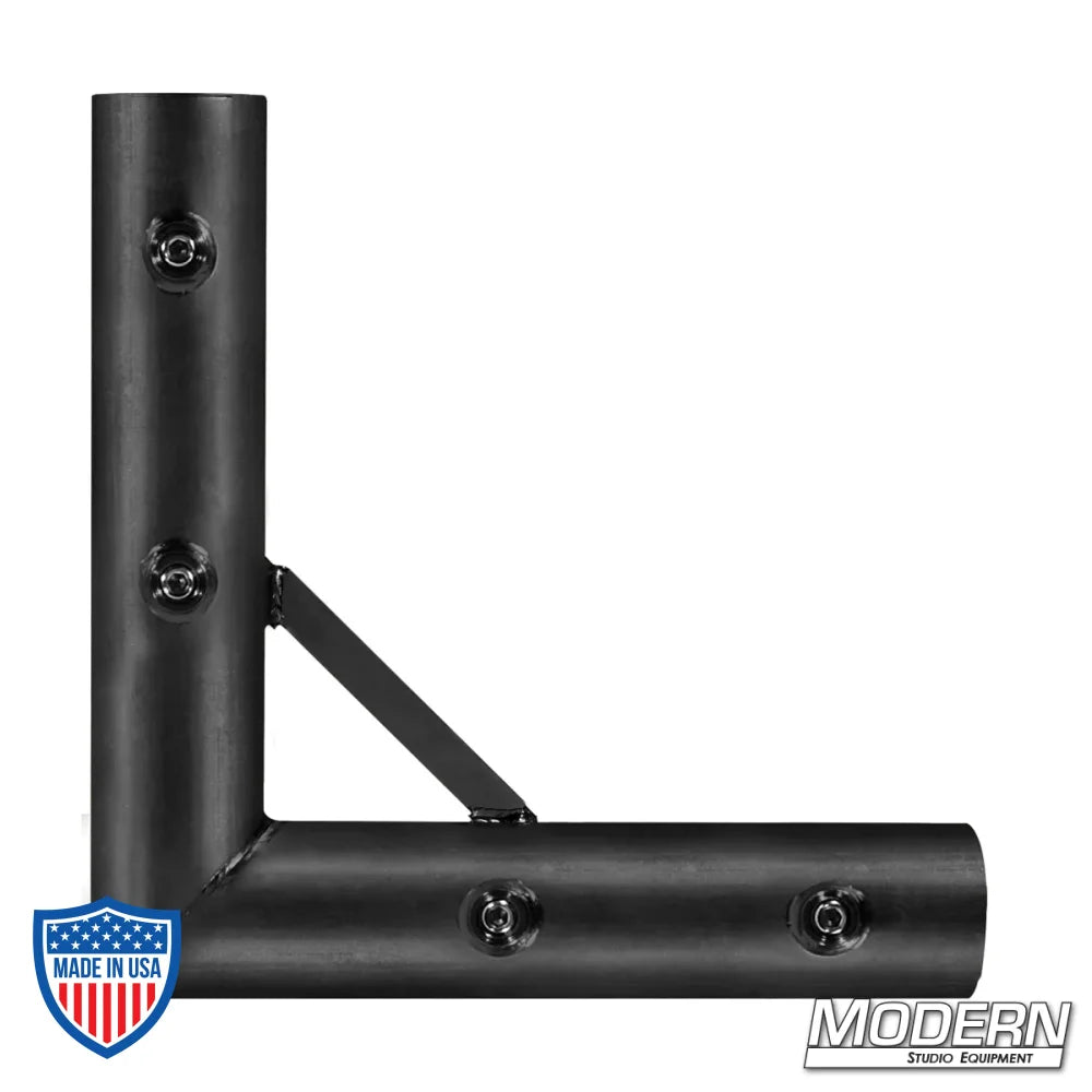 Black zinc 1-1/4" Speed-Rail® corner fitting for film grip and rigging with set screws.