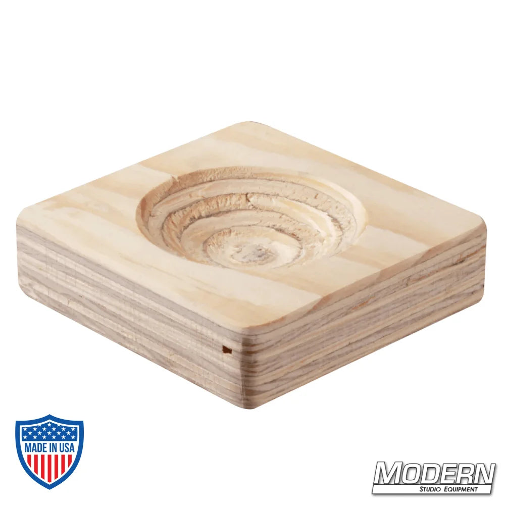 Wooden cup block for film grip rigging, used to brace and support objects on a shoot. Measures 5-1/2" x 5-1/2" x 1-1/2".