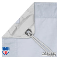 Close-up of Day Blue Muslin slip with elastic corners, grommets, and ties for film rigging, Modern Studio Equipment logo in the corner.