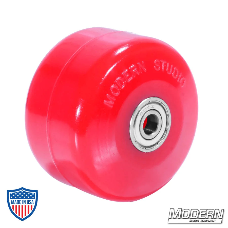 Deluxe red skateboard wheel with bearings for film rigging and grip jobs.