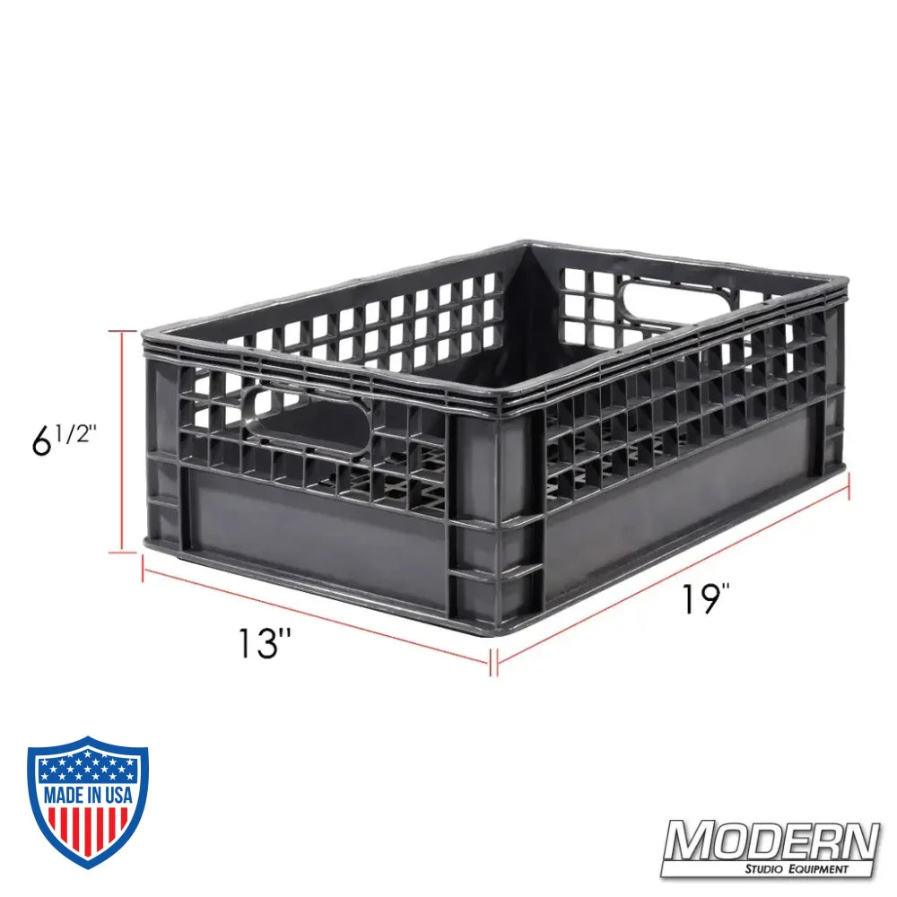 Half Milk Crate made from industry-grade plastic, measures 19" x 13" x 6.5", stackable with a clean grid bottom, ideal for film grip rigging.