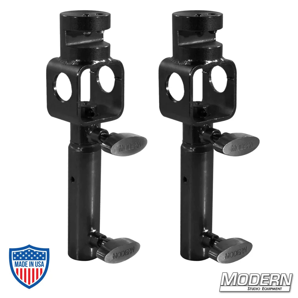 Set of two black zinc I-beam clamps with junior swivel receivers for film grip and rigging equipment.