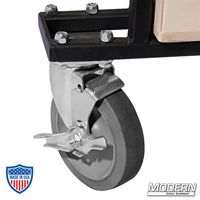 Close-up of front swivel caster with locking brake on Large Grip Cart for film grip and rigging equipment.