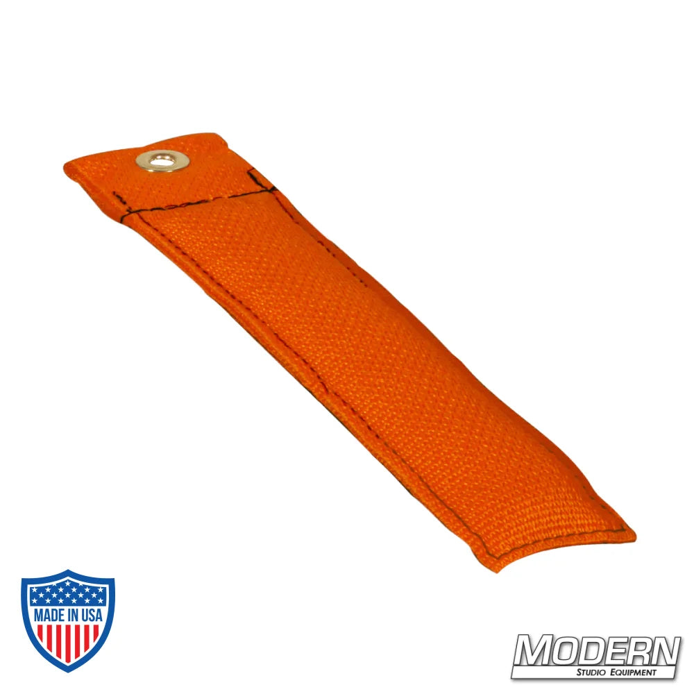 Modern Studio Equipment’s 4" orange marker for film grip and rigging, made of durable Cordura 1000 fabric and filled with shot for stability.