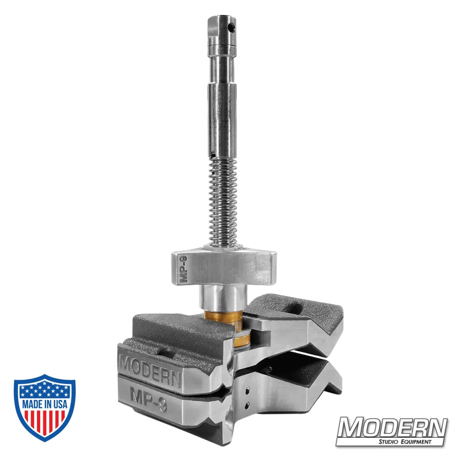 MP-9 film grip rigging clamp for versatile rigging, featuring a 5/8" baby pin, nine positions, capable of clamping tubing or rods from 3/8" to 4" diameter.