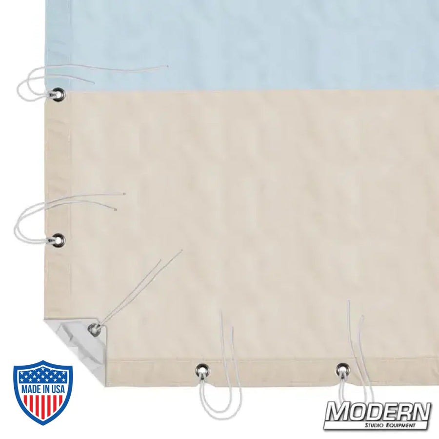 12' x 12' Natural Bounce muslin with sky blue and beige sections, webbing, grommets, and ties, for film grip and rigging, with storage bag.
