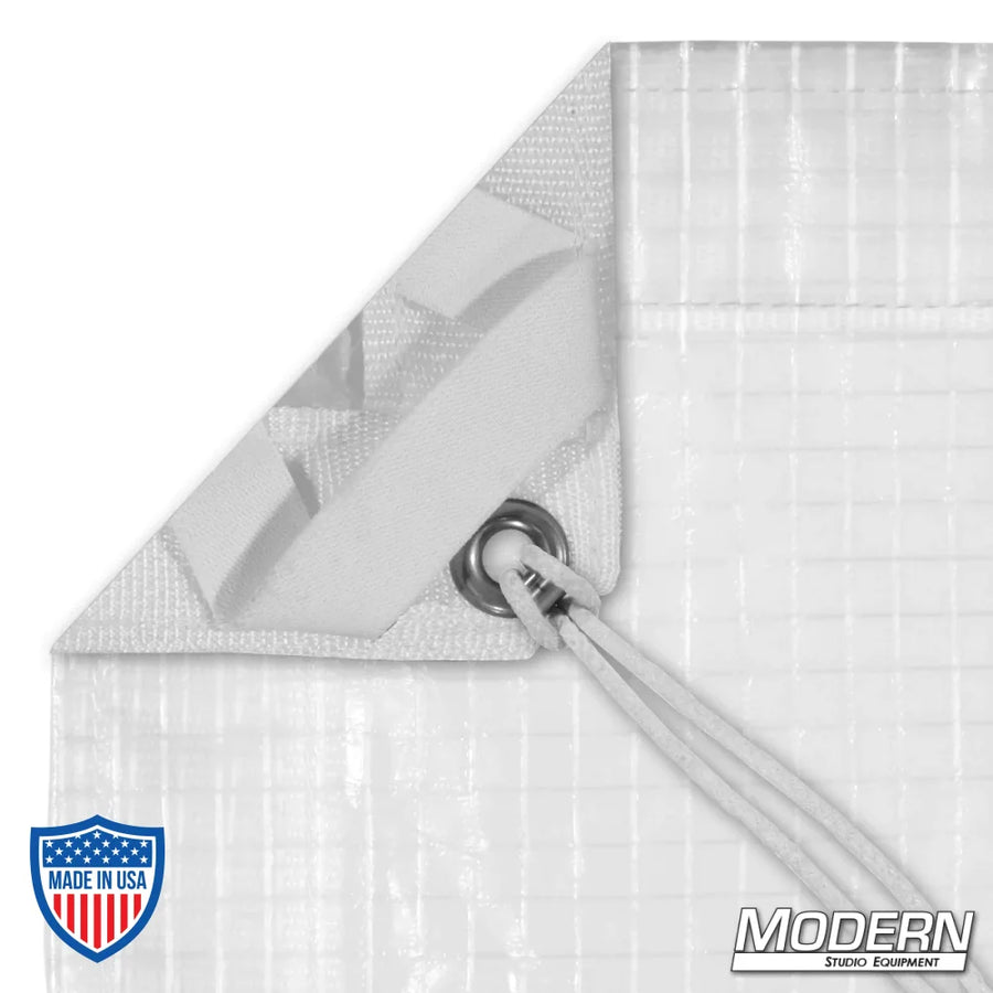 Close-up of Noisy 1/4 Grid Cloth corner, showing webbing, grommet, and ties, used for film grip and rigging.