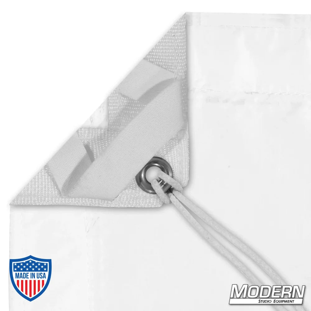 Corner of Noisy Full Grid Cloth with webbing, grommet, and elastic tie for film grip rigging.