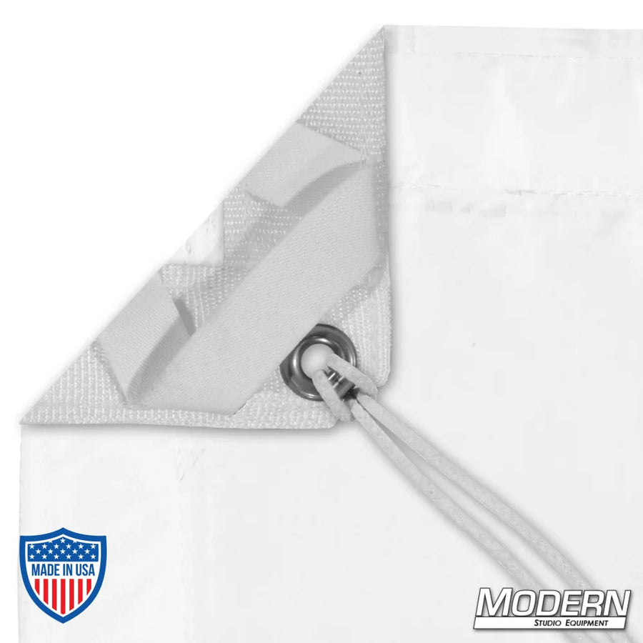 Corner of Noisy Full Grid Cloth with webbing, grommet, and elastic tie for film grip rigging.