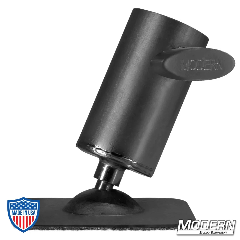 Black zinc pipe flange base with swivel and T-handle for 1-1/2" speed-rail, designed for film grip rigging, shown on flat plate.