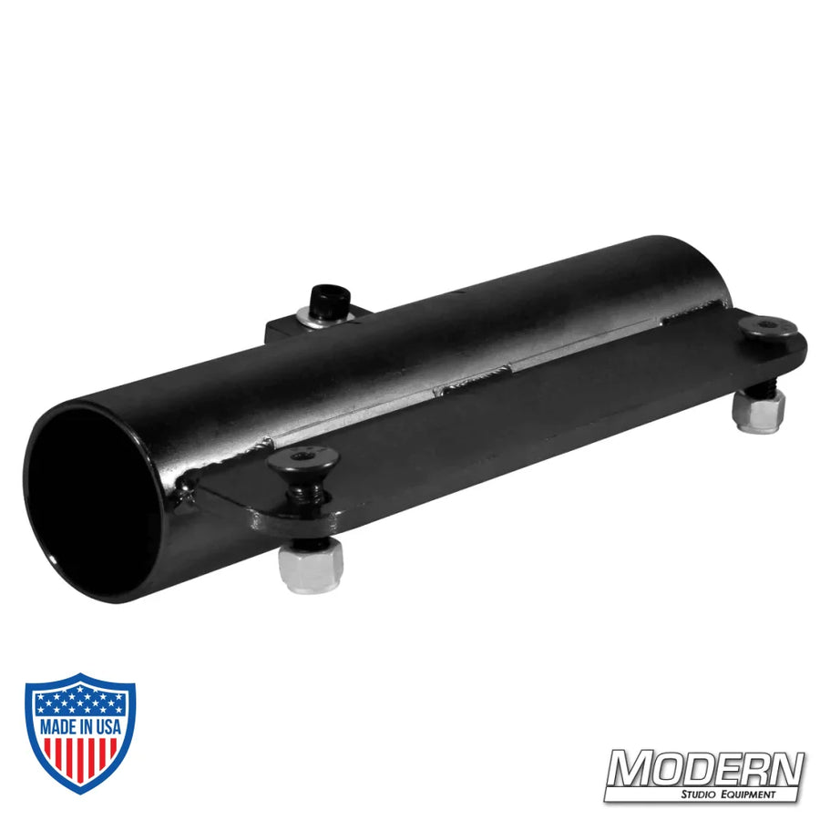 Black zinc plate slider bracket for 1-1/4" Schedule 40 aluminum Speed-Rail, used in film grip rigging.