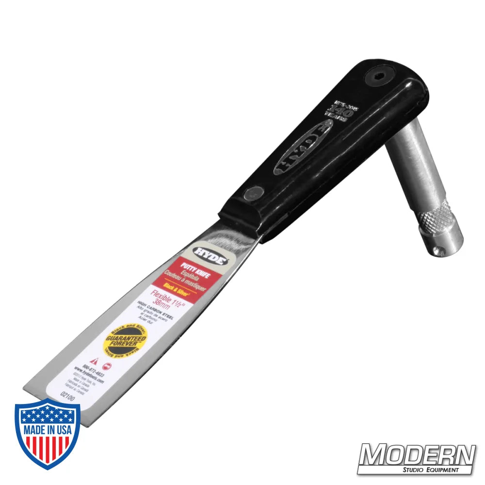 Putty knife with 5/8" baby pin for film grip rigging and lightweight light mounting.