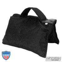 Black 10 lb sandbag with black handle for film grip and rigging, made from durable Cordura 1000 and filled with silica sand.