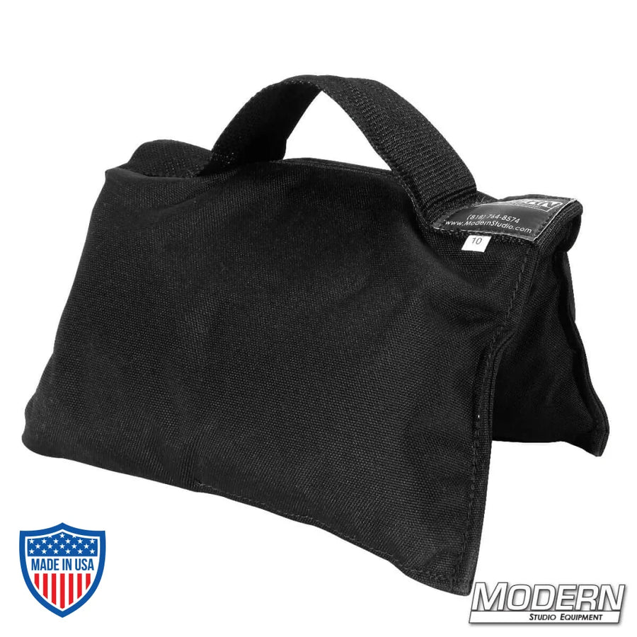 Black 10 lb sandbag with black handle for film grip and rigging, made from durable Cordura 1000 and filled with silica sand.
