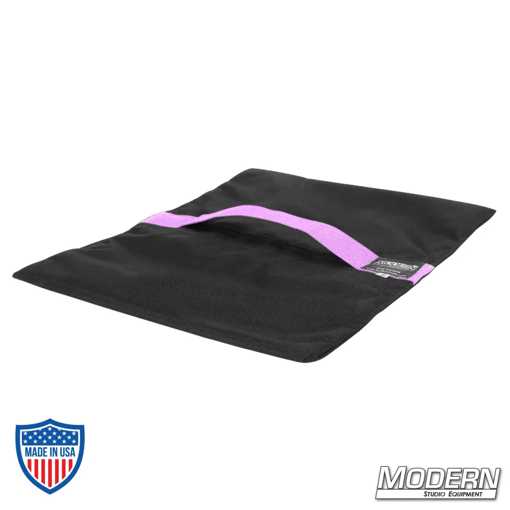 Flyaway sandbag for film grip and rigging, made with durable Cordura 1000, featuring a velcro closure, 15 lbs capacity, empty, black with purple stripe