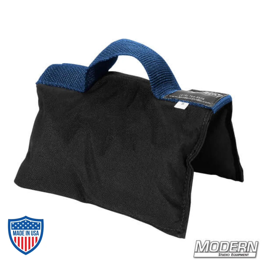 Black sandbag with blue handle, filled with five pounds of silica sand, made of Cordura 1000, ideal for film, grip, and rigging purposes.