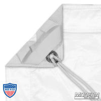 Close-up view of Silent 1/2 Grid Cloth with grommet and tie, featuring webbing along the edges, used in film grip rigging.