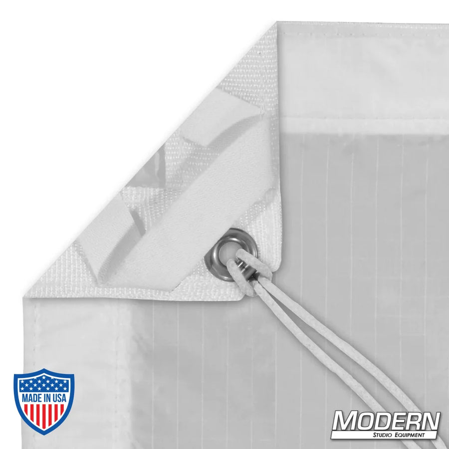 Silent 1/4 Grid Cloth for film rigging with webbing, grommet, and ties on sides. Includes storage bag. Ideal for diffusing light sources.