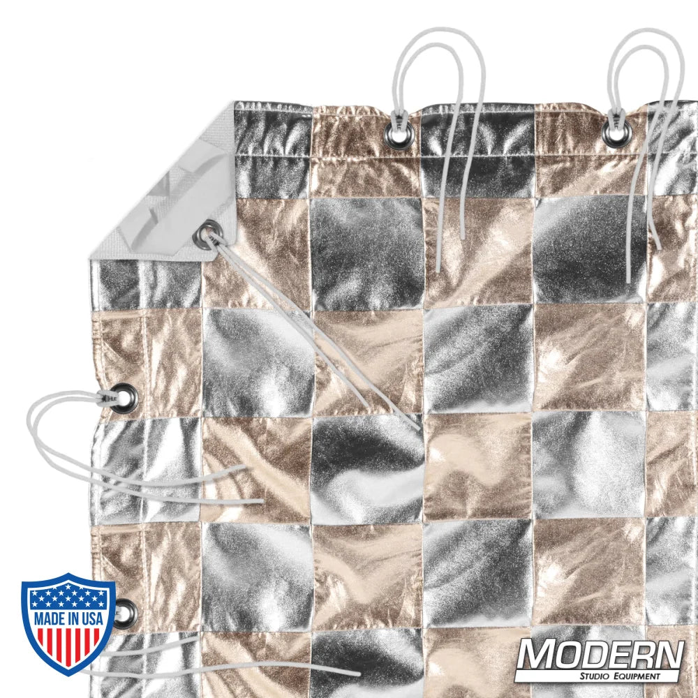 Silver and gold checker pattern textile for film grip rigging with webbing, grommets, ties, and corner elastics, includes storage bag.