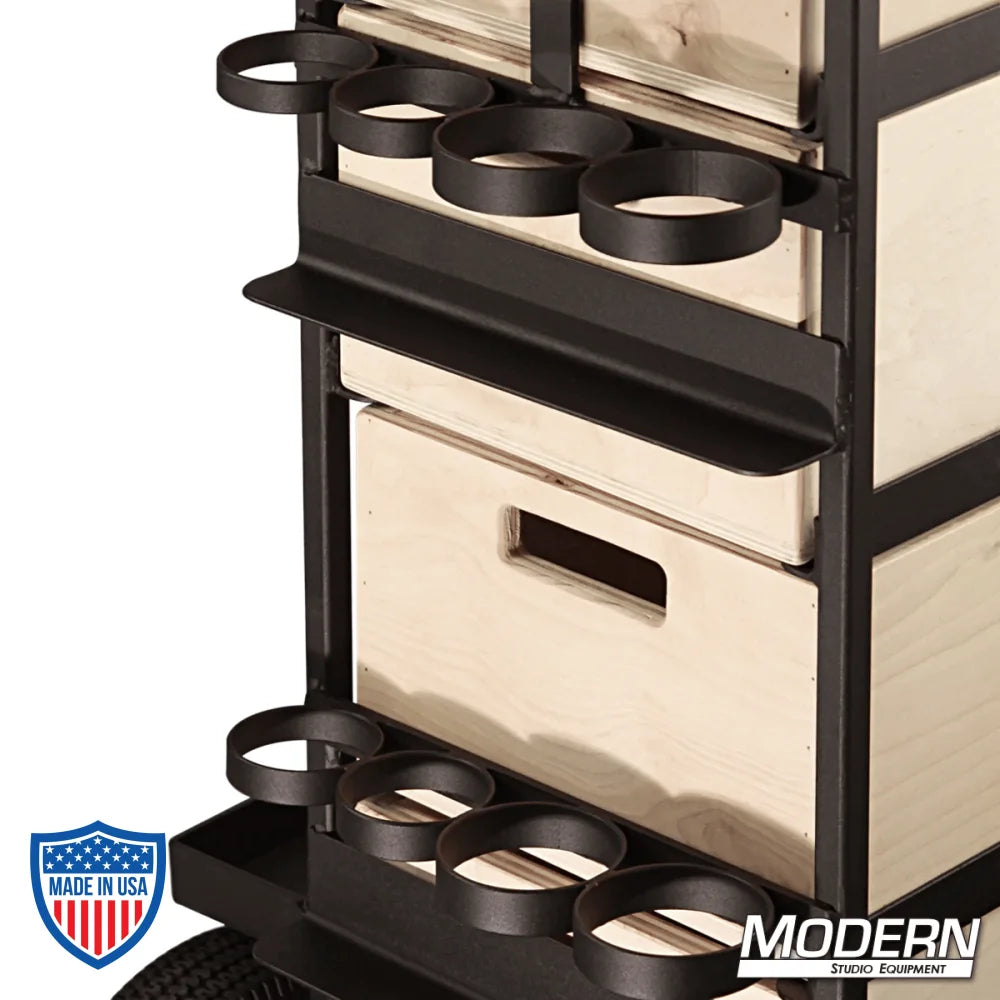 Small grip cart with wooden drawers and caster wheels for film rigging equipment. Features holders for accessories.